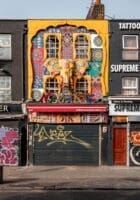 The colourful, graffiti covered shopfronts of Camden High Street