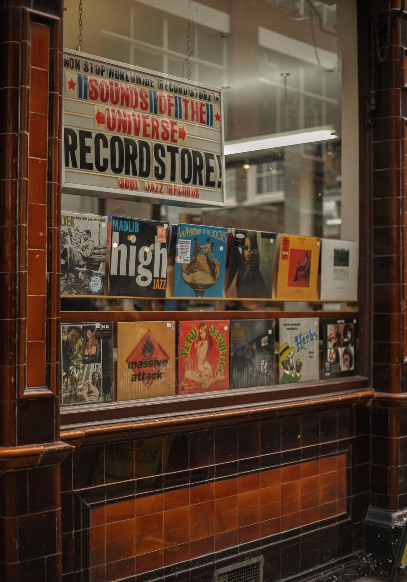 A window display featuring vinyl records in Soho